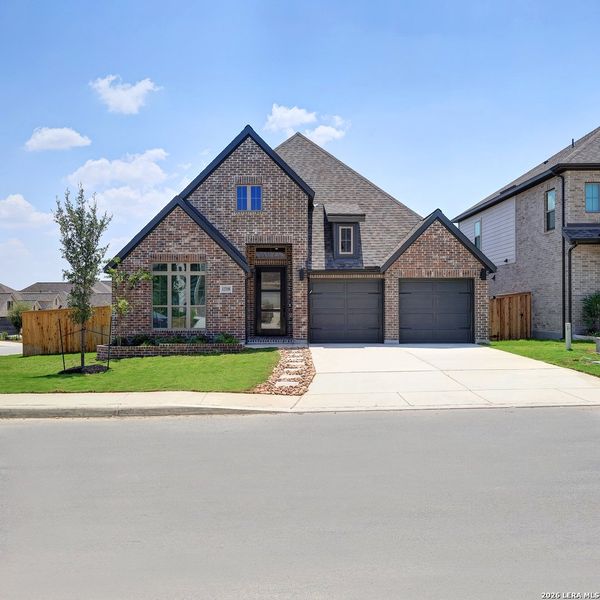 Front exterior of a new home in Arcadia Ridge, San Antonio, TX, highlighting curb appeal (Image 2).