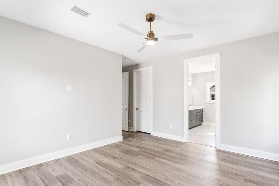 Representative unfurnished interior of a home built from the Pearl by Brock Built in Nautilus Pointe, Inlet Beach (Image 29).