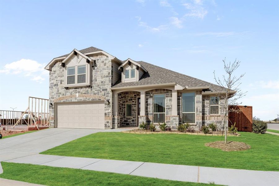 Front exterior of a new home in Timberbrook, Justin, TX, highlighting curb appeal (Image 25).