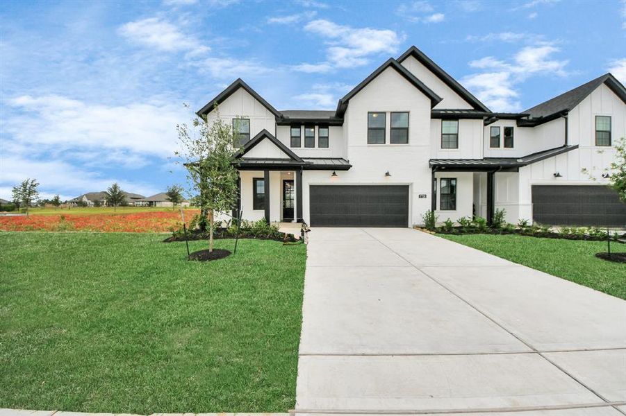 Front exterior of a new home in Elyson: Elyson Duets, Katy, TX, highlighting curb appeal (Image 24). Front exterior of a new home in Elyson: Elyson Duets, Katy, TX, highlighting curb appeal (Image 24).