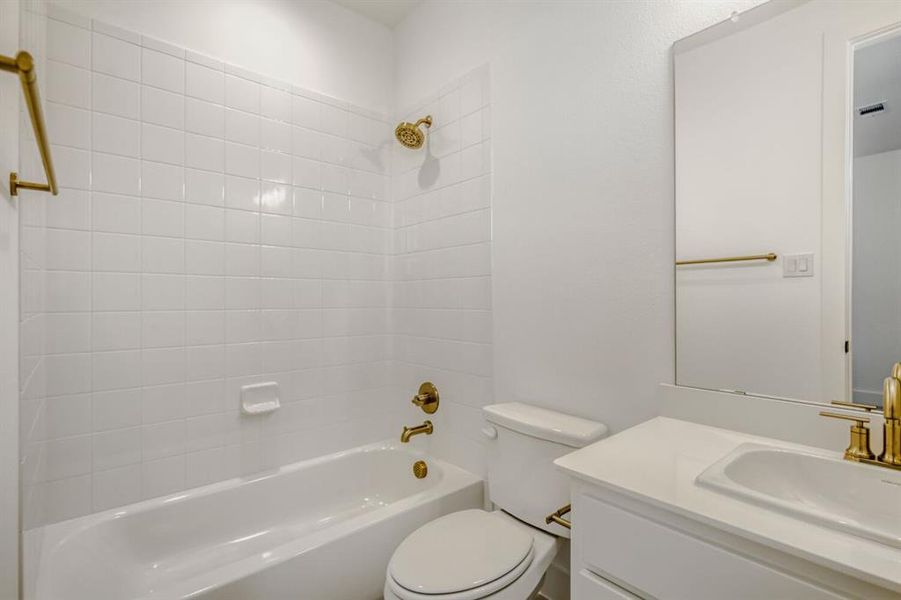 Full bath featuring vanity and shower / washtub combination