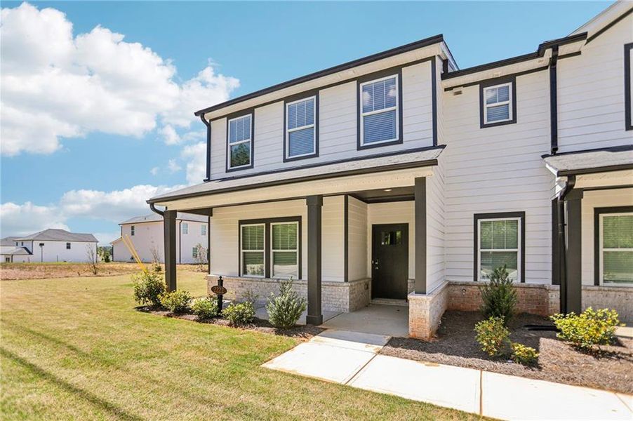 Front exterior of a new home in Avalon - Vista Series, Conyers, GA, highlighting curb appeal (Image 23).
