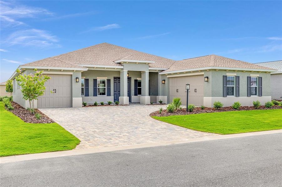 Front exterior of a new home in On Top of the World Communities, Ocala, FL, highlighting curb appeal (Image 23). Front exterior of a new home in On Top of the World Communities, Ocala, FL, highlighting curb appeal (Image 23).