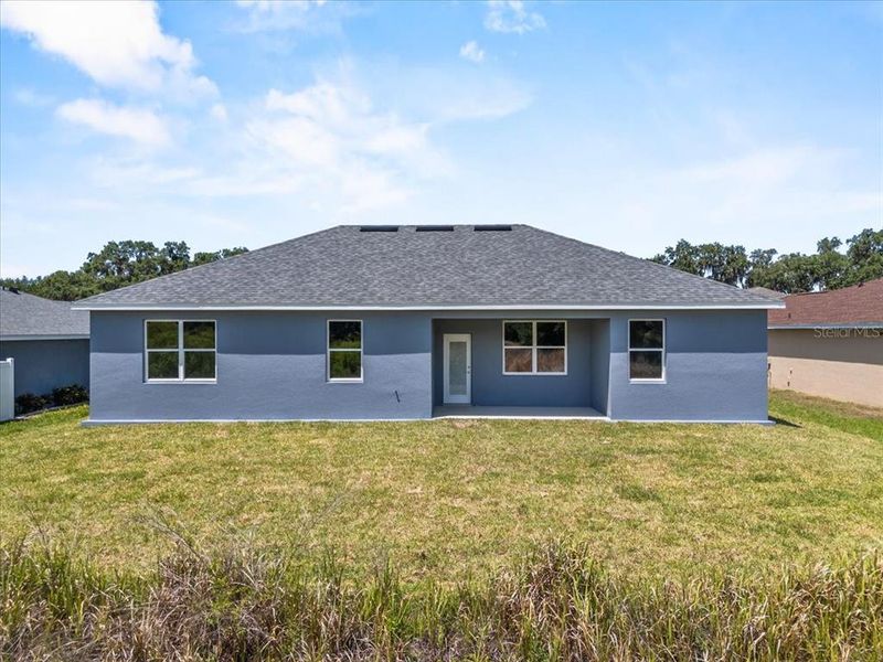 Front exterior of a new home in , Mulberry, FL, highlighting curb appeal (Image 20).