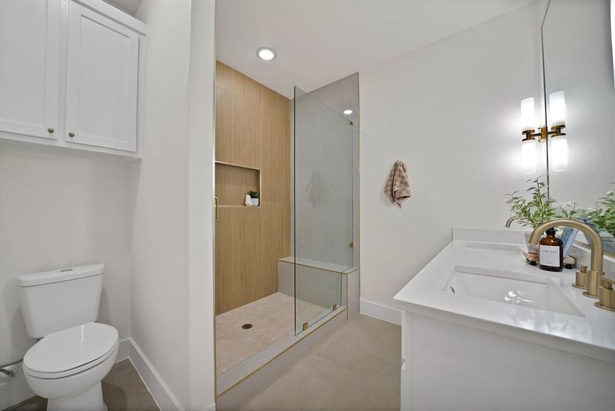 Full bath with a shower stall, double vanity, recessed lighting, and light tile patterned floors Full bath with a shower stall, double vanity, recessed lighting, and light tile patterned floors