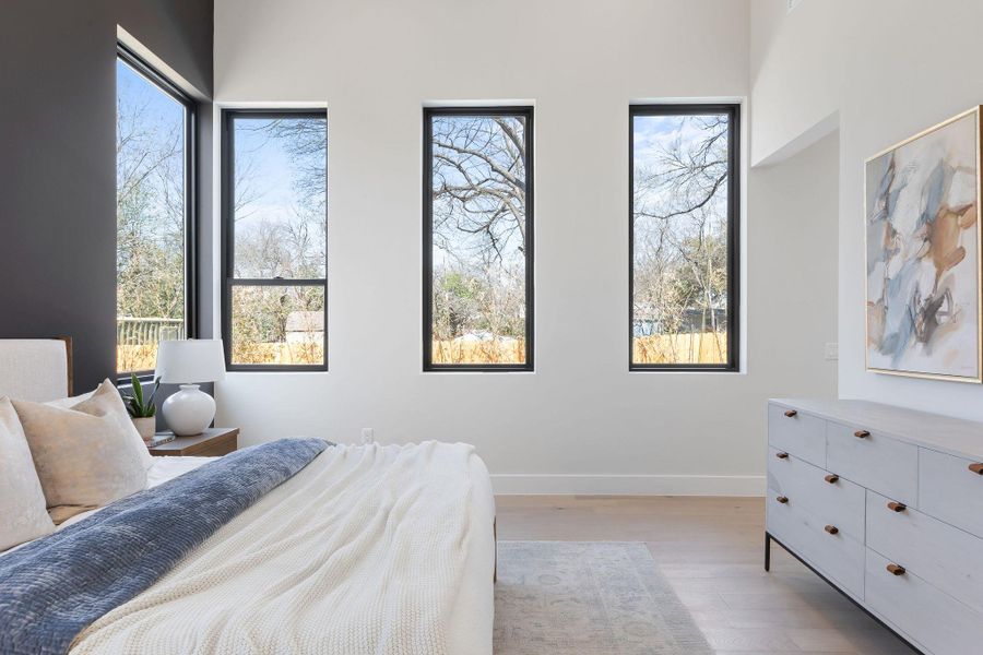 Bedroom featuring wood finished floors and baseboards