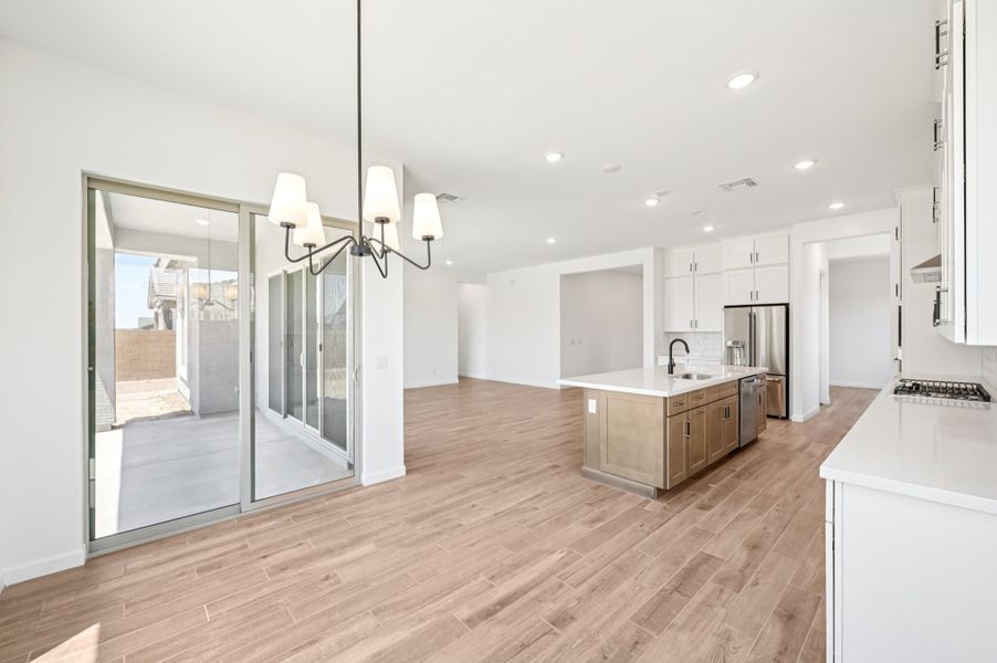 Dining nook into kitchen and great room. Finishes and options may vary. Dining nook into kitchen and great room. Finishes and options may vary.