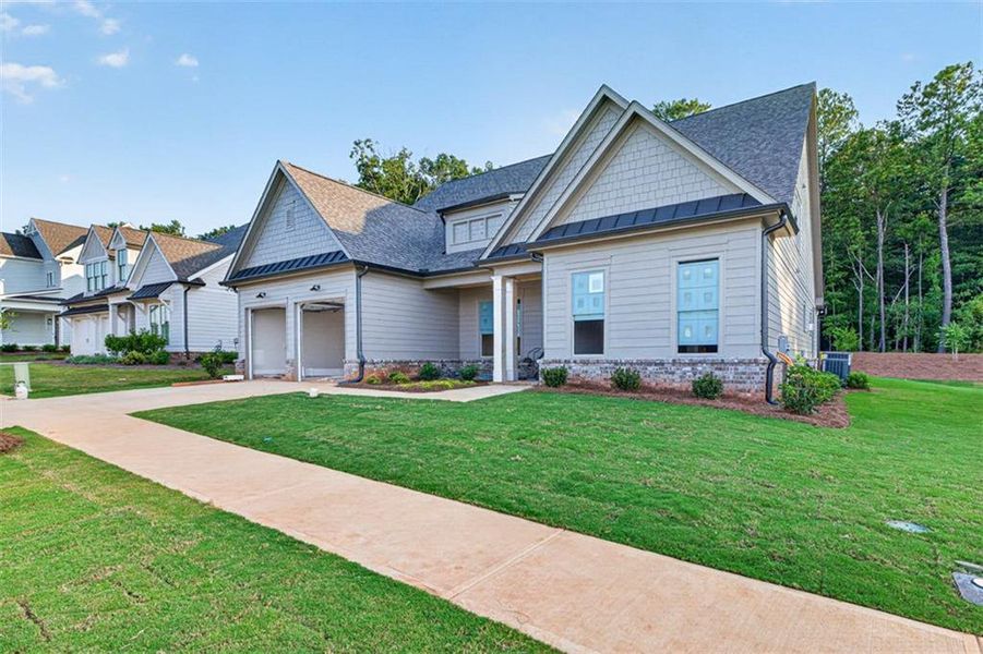 Front exterior of a new home in , Statham, GA, highlighting curb appeal (Image 11). Front exterior of a new home in , Statham, GA, highlighting curb appeal (Image 11).