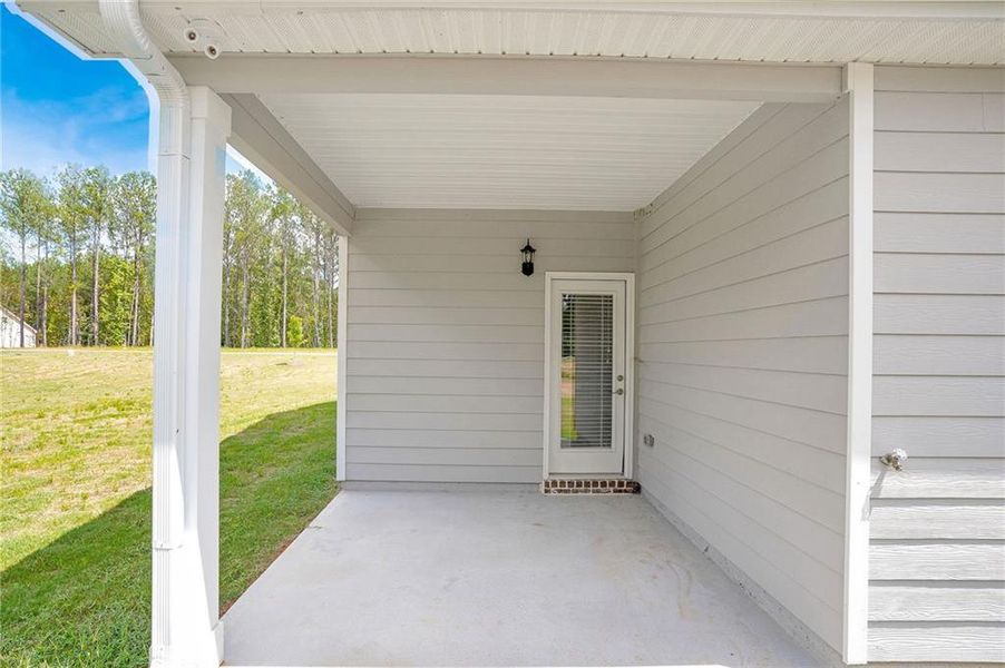 Exterior details and patio area of a home in Waters Edge, Mansfield (Image 3).