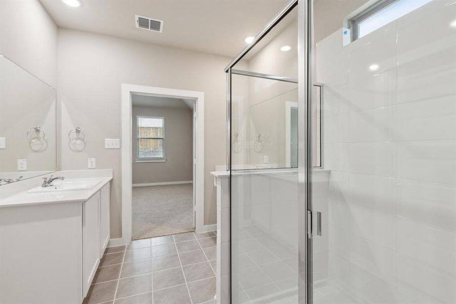 Primary bathroom in the Elm home plan by Trophy Signature Homes – REPRESENTATIVE PHOTO