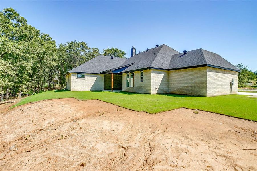 Front exterior of a new home in Escondido Ranches, Poolville, TX, highlighting curb appeal (Image 23). Front exterior of a new home in Escondido Ranches, Poolville, TX, highlighting curb appeal (Image 23).