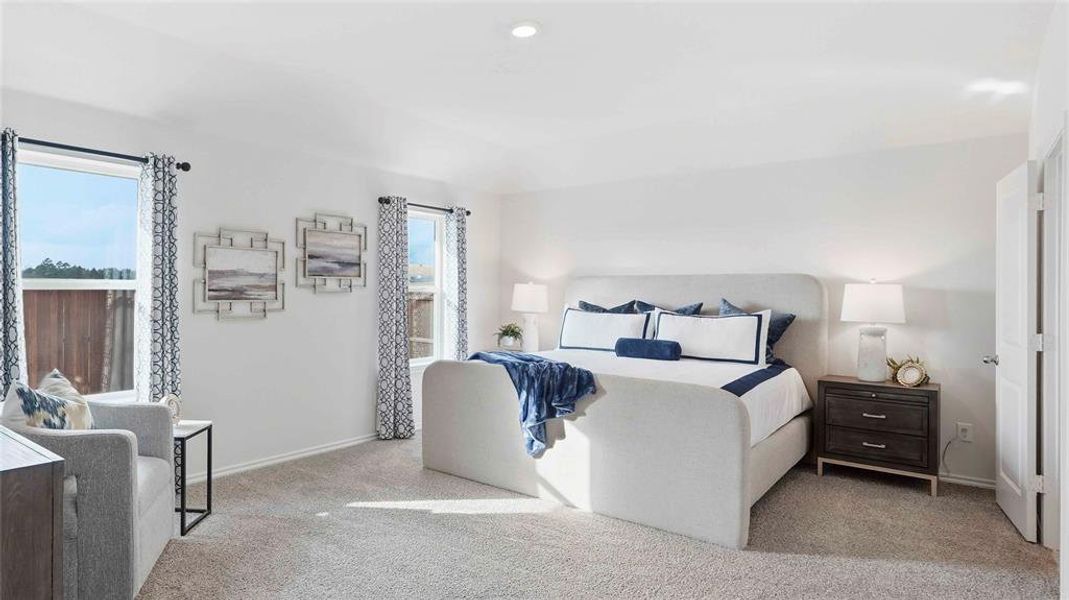 Carpeted bedroom with baseboards