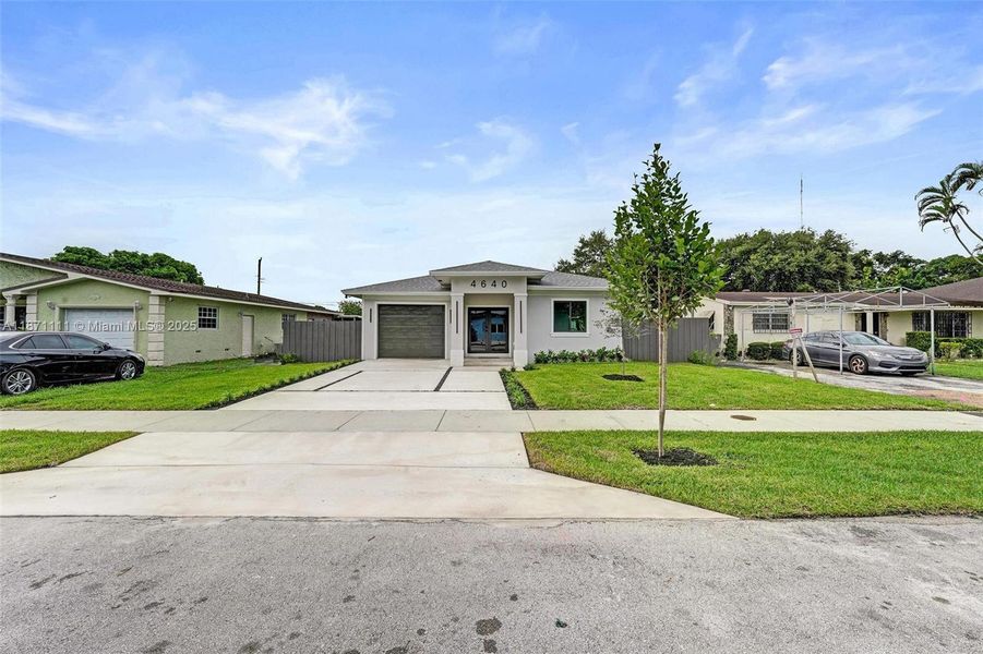 Front exterior of a new home in , West Park, FL, highlighting curb appeal (Image 24). Front exterior of a new home in , West Park, FL, highlighting curb appeal (Image 24).