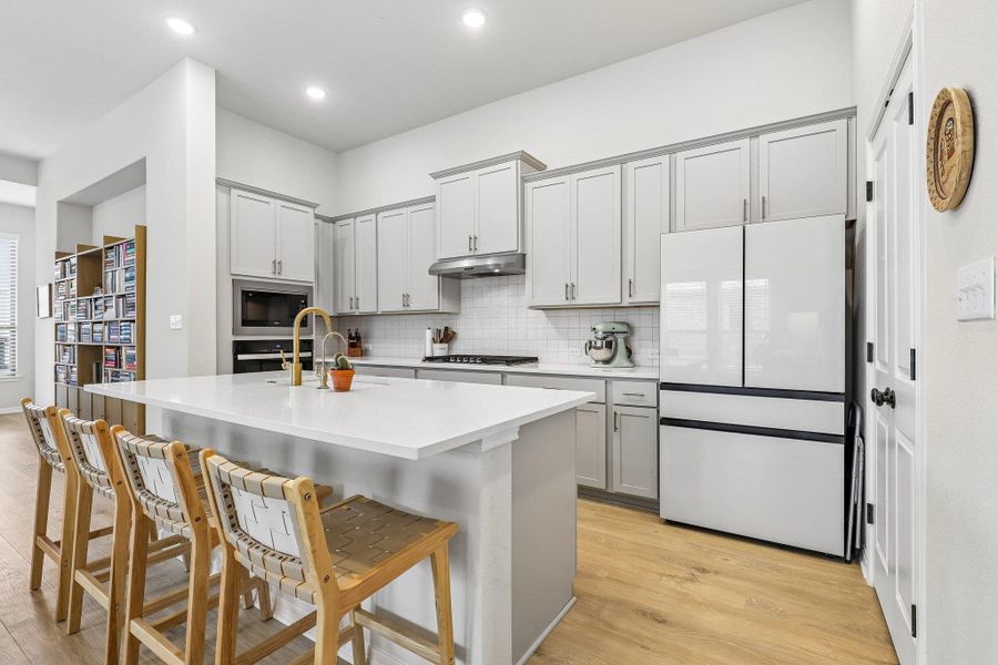 Culinary aspirations come to life in this kitchen, boasting an expansive island with a breakfast bar.