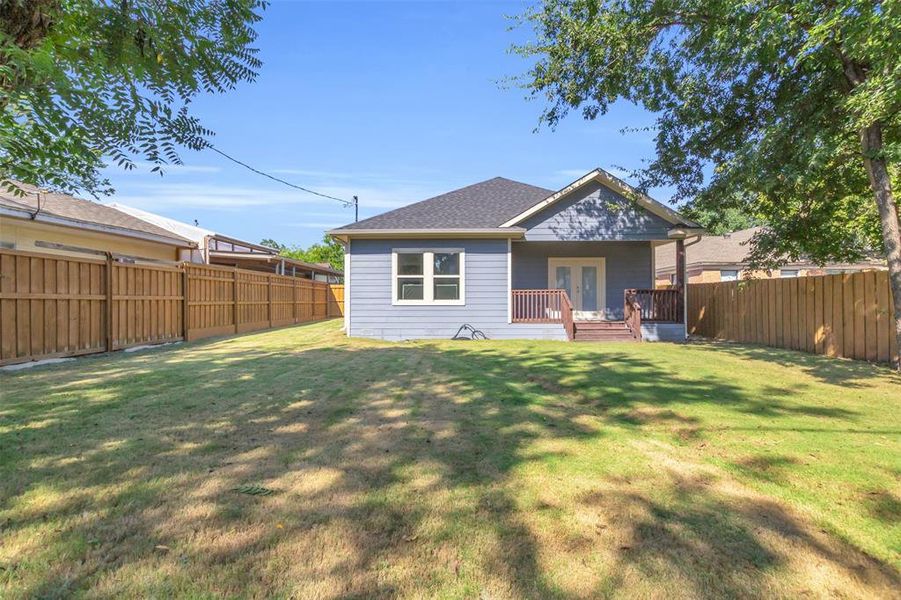 Back of house featuring a fenced backyard