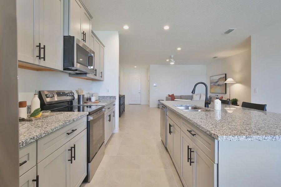 Representative furnished interior of a home built from the Morgan by Neal Communities in SkySail, Naples (Image 22).