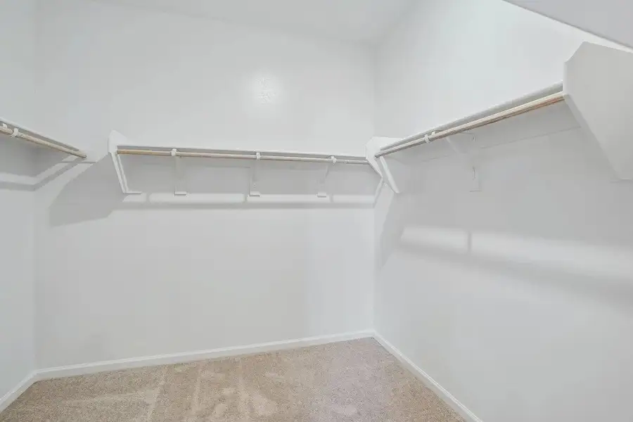 Primary walk in closet. Representative images and renderings are for illustrative purposes. Actual structural options and design finishes of home may vary.