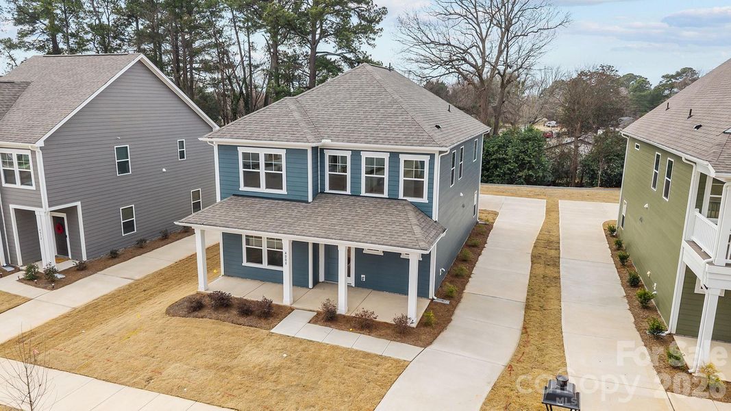 Front exterior of a new home in Arbor Village, Matthews, NC, highlighting curb appeal (Image 21).