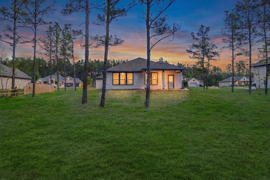 Exterior details and patio area of a home in Deer Pines, Conroe (Image 3).