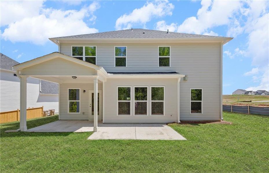 Exterior details and patio area of a home in Reunion, Flowery Branch (Image 29).