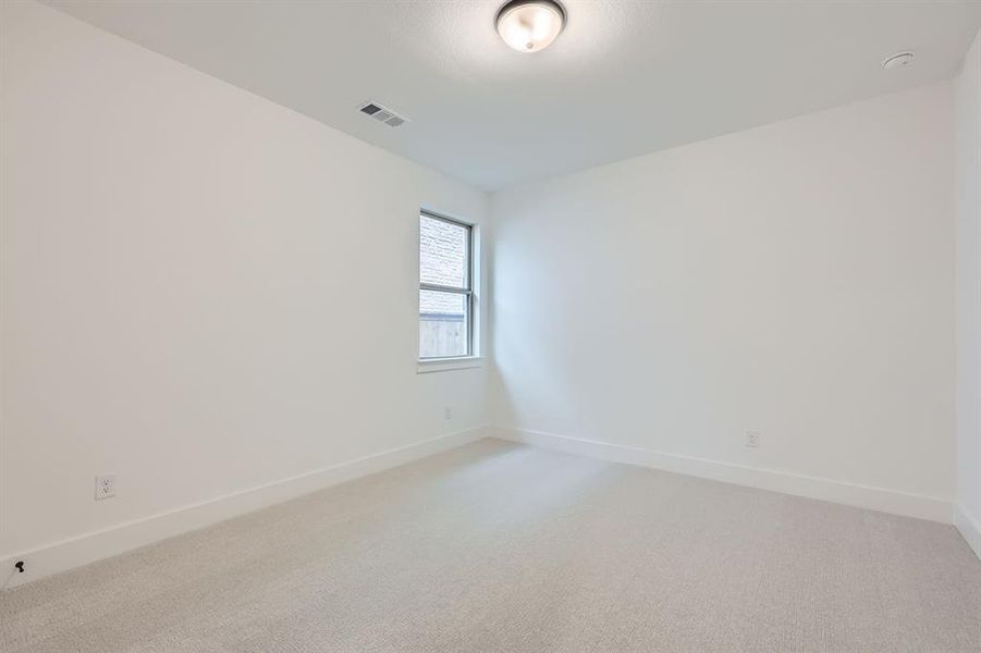 Empty room featuring carpet