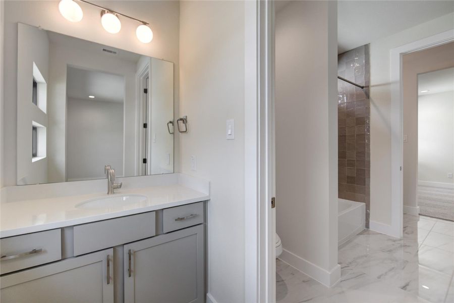 One of the two secondary bathrooms on the second floor