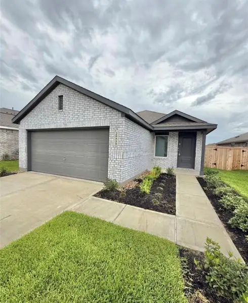 Front exterior of a new home in The Grand Prairie: Cottage Collection, Hockley, TX, highlighting curb appeal (Image 1).