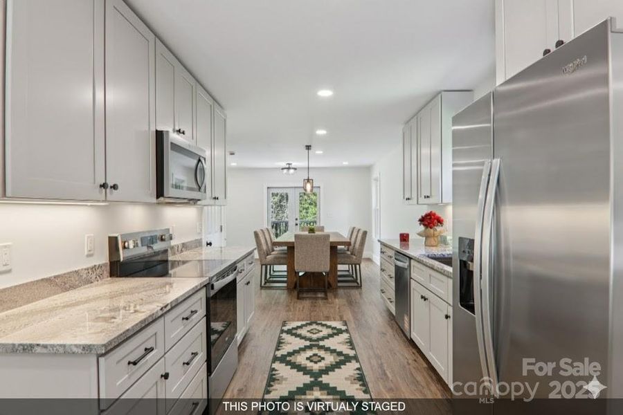 Furnished interior view inside a new home in , Waynesville (Image 13).