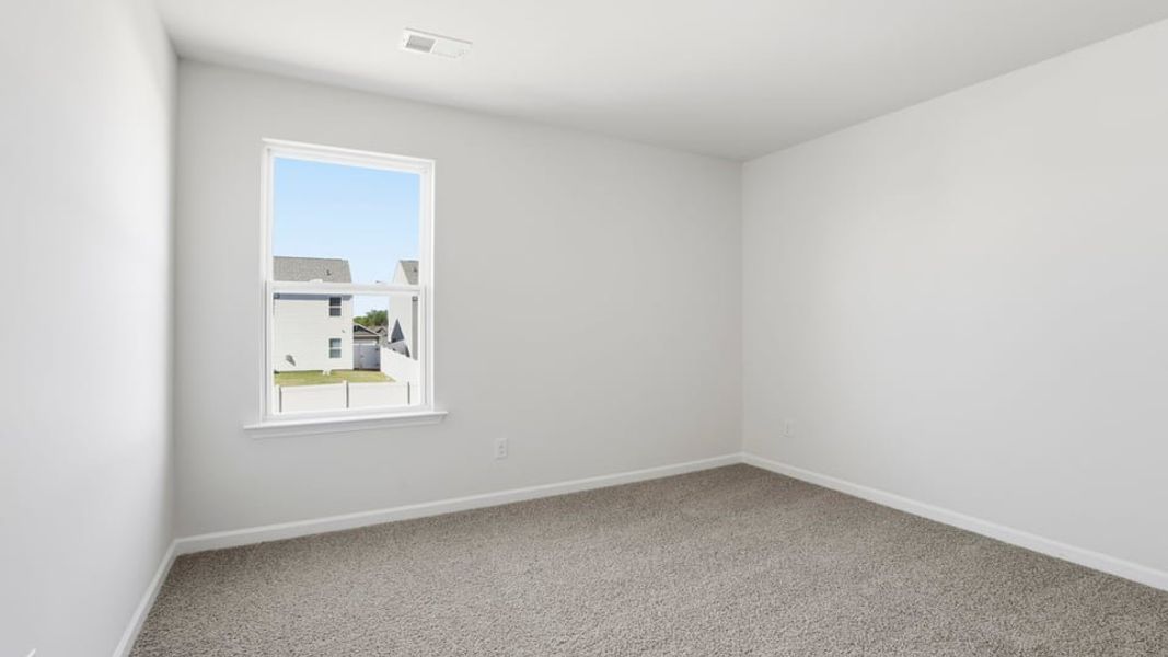 Spacious, unfurnished interior of a new home in Durbin Meadows Traditions, Fountain Inn (Image 27).