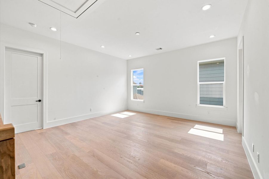 Bright, open game room offers flexible living space.