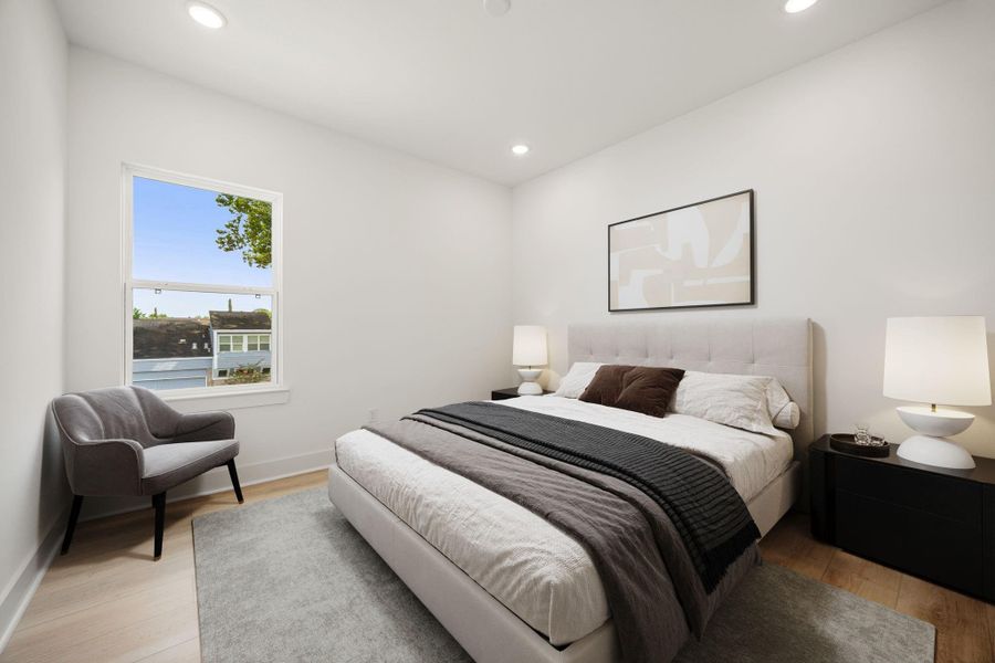 Secondary bedroom features wood like vinyl flooring, neutral paint and a large window allowing in natural light. Secondary bedroom features wood like vinyl flooring, neutral paint and a large window allowing in natural light.