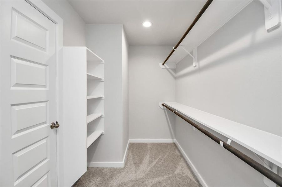 Walk-In closet. Sample photo of completed plan. As built color and selections may vary.