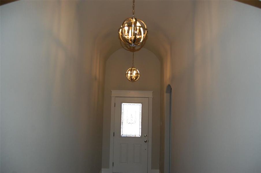 Entryway featuring an inviting chandelier