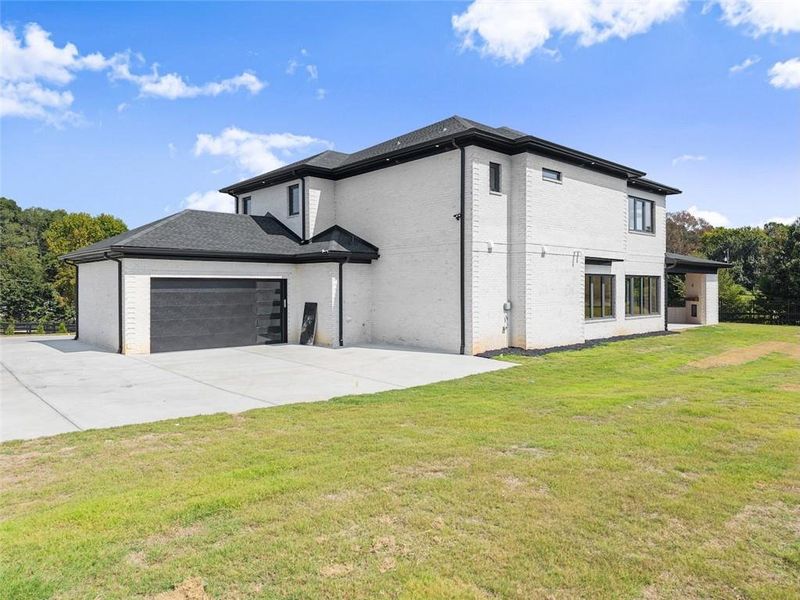Front exterior of a new home in , Dacula, GA, highlighting curb appeal (Image 24).