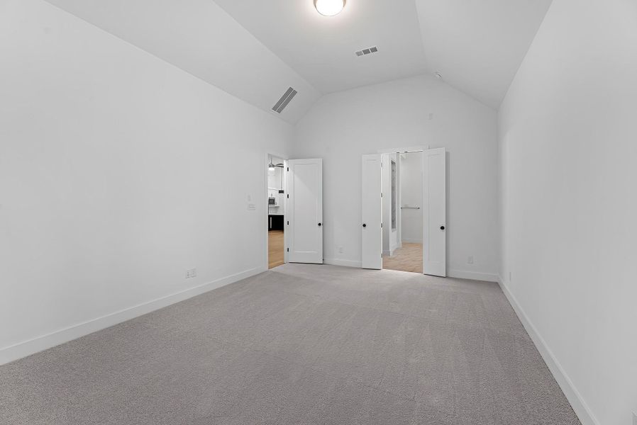 Additional view of the primary bedroom showing the entrance to your ensuite bathroom. Additional view of the primary bedroom showing the entrance to your ensuite bathroom.