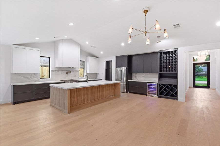 Designed to impress, this chef-inspired kitchen features a massive island perfect for entertaining, dining, and everyday living.