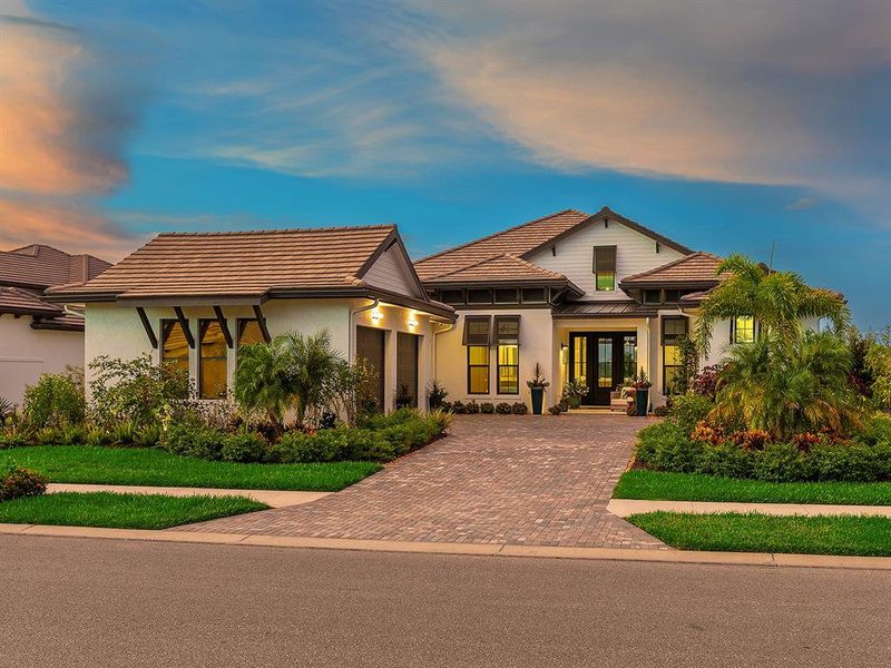 Front exterior of a new home in Wild Blue at Waterside, Sarasota, FL, highlighting curb appeal (Image 22). Front exterior of a new home in Wild Blue at Waterside, Sarasota, FL, highlighting curb appeal (Image 22).