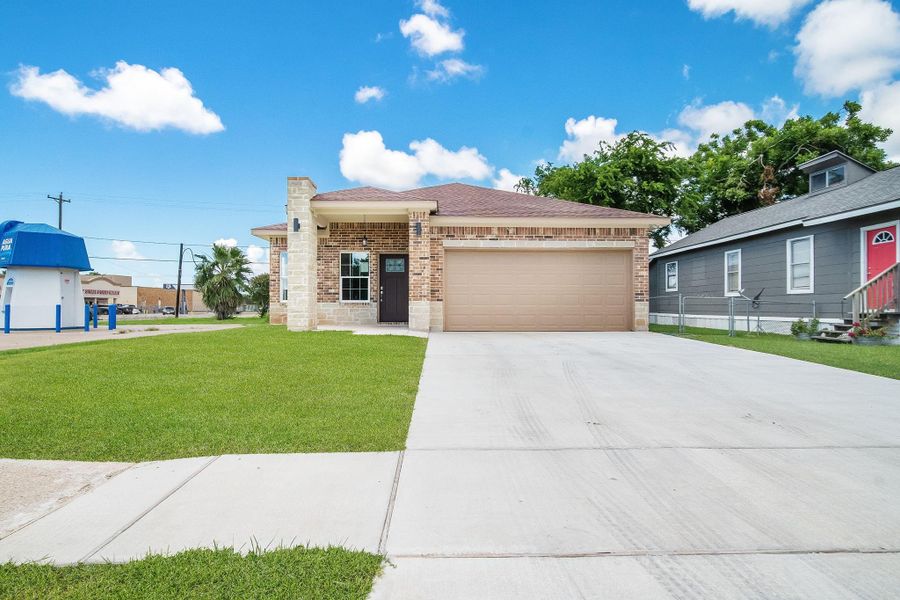 Front exterior of a new home in , Freeport, TX, highlighting curb appeal (Image 15).