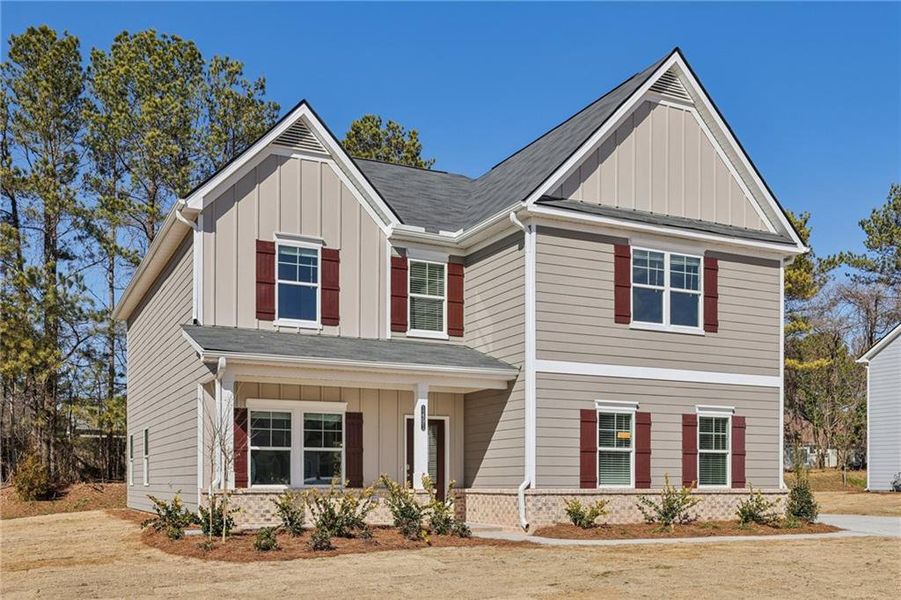 Front exterior of a new home in Stephen's Landing, Loganville, GA, highlighting curb appeal (Image 1).