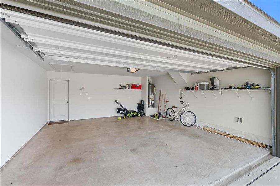 Garage featuring water heater