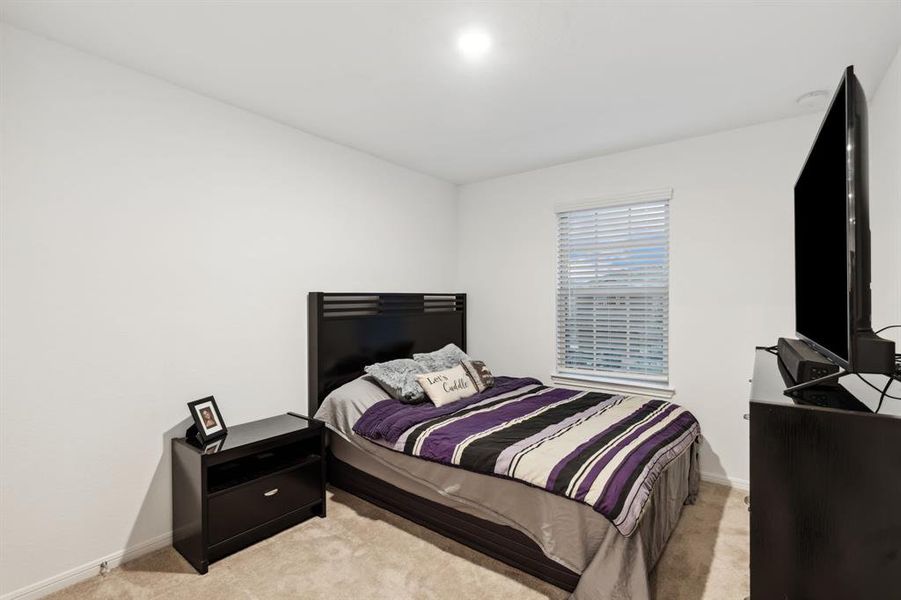 Secondary bedroom with plenty of space for a full bedroom furniture set.