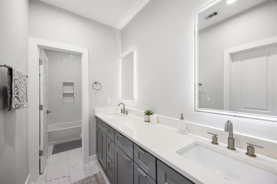 second full bath room with double vanity and led mirrors