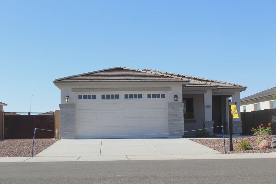 Front exterior of a new home in Camilo at Santana, Yuma, AZ, highlighting curb appeal (Image 2).