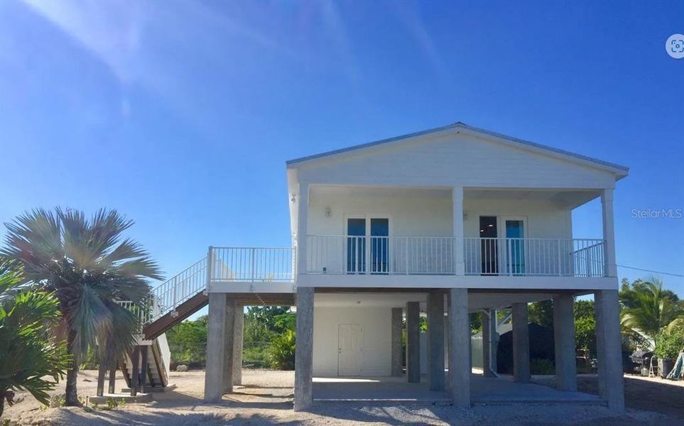 Front exterior of a new home in Harbour Heights, Punta Gorda, FL, highlighting curb appeal (Image 1).