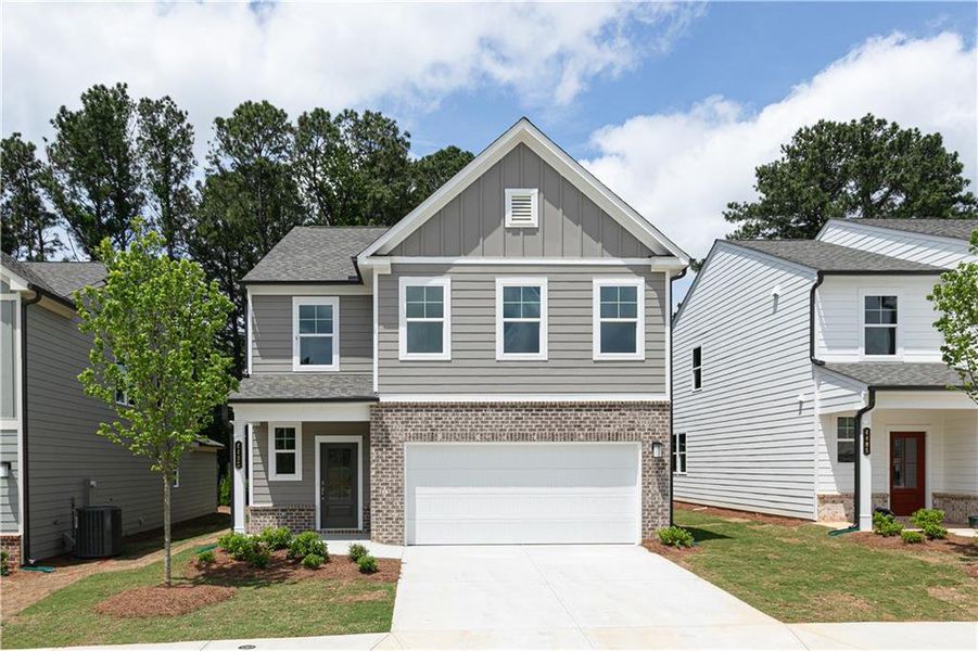 Front exterior of a new home in Kingsley, Acworth, GA, highlighting curb appeal (Image 1). Front exterior of a new home in Kingsley, Acworth, GA, highlighting curb appeal (Image 1).