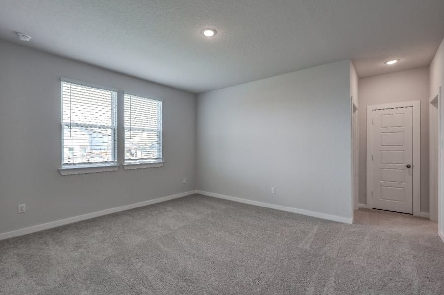 A room with a white door and a white wall with a window. A room with a white door and a white wall with a window.