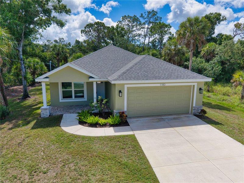 Front exterior of a new home in , Englewood, FL, highlighting curb appeal (Image 2). Front exterior of a new home in , Englewood, FL, highlighting curb appeal (Image 2).