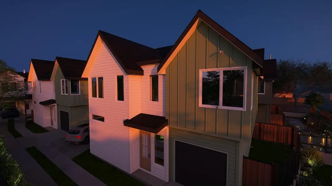 View of front of property with board and batten siding, roof with shingles, and a garage