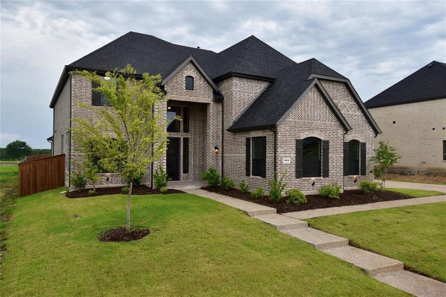 Front exterior of a new home in , Prosper, TX, highlighting curb appeal (Image 2).