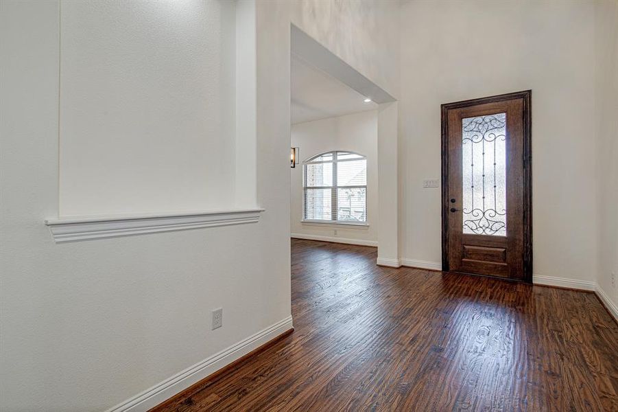 Entrance foyer with dark wood-type flooring